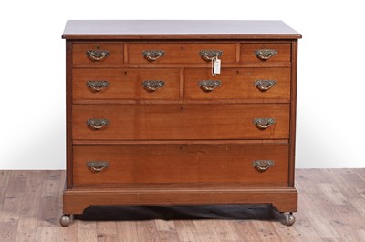 Lot 57 - An early 20th Century walnut chest of drawers