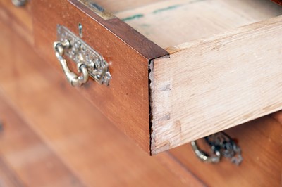 Lot 57 - An early 20th Century walnut chest of drawers