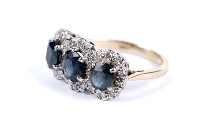 Lot 90 - A sapphire and diamond cluster dress ring