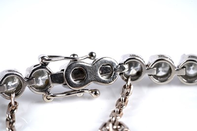 Lot 565 - A diamond tennis bracelet