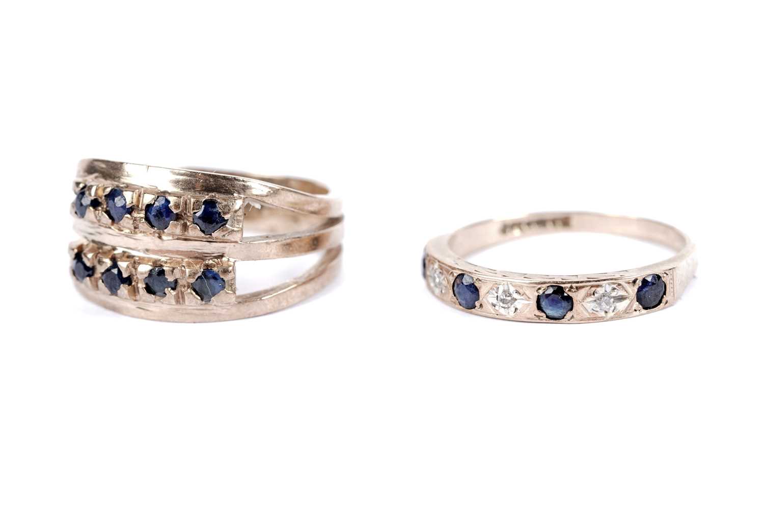 Lot 46 - A sapphire and diamond half hoop eternity ring; and another