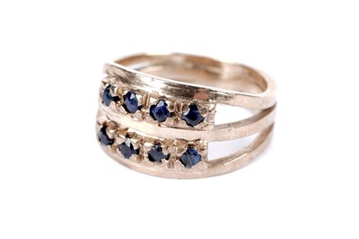 Lot 46 - A sapphire and diamond half hoop eternity ring; and another