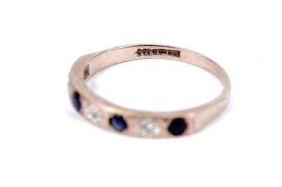 Lot 46 - A sapphire and diamond half hoop eternity ring; and another