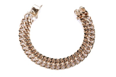 Lot 55 - A 9ct yellow gold double curb link chain bracelet