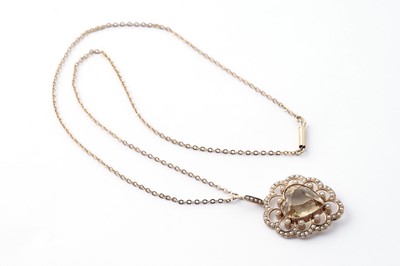 Lot 57 - An Edwardian citrine and seed pearl heart pendant necklace