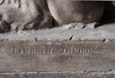 Lot 1260 - A Coade stone garden sculpture of a recumbent lion