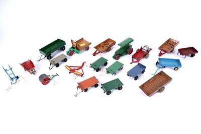 Lot 93 - A collection of Dinky Toys farm vehicles and accessories