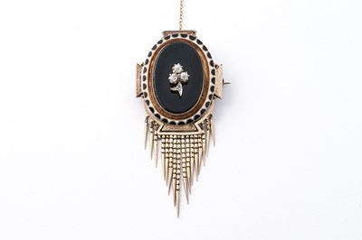 Lot 74 - A Victorian diamond, onyx and enamel mourning brooch