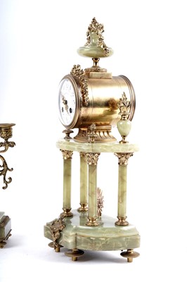 Lot 171 - A French onyx and gilt metal clock and garniture by Mesnard & Fils