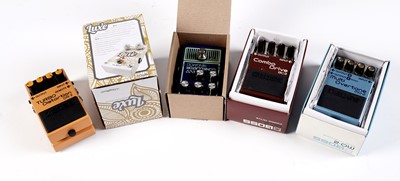 Lot 349 - Three Boss guitar pedals; and two others