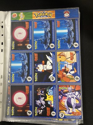 Lot 328 - A collection of Pokémon promotional cards and materials; and other items