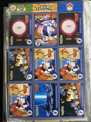 Lot 328 - A collection of Pokémon promotional cards and materials; and other items