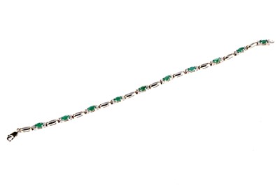 Lot 150 - An emerald and diamond line bracelet