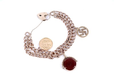 Lot 168 - A 9ct gold curb link bracelet with a sovereign and other charms