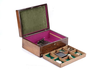 Lot 210 - A selection of costume jewellery in a mother-of-pearl inlaid jewellery box