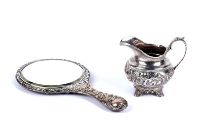 Lot 247 - ﻿﻿A Victorian Newcastle silver jug; and an Edwardian silver hand mirror