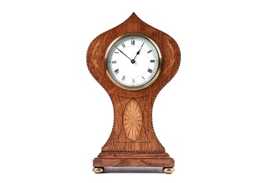 Lot 169 - An Edwardian inlaid oak balloon-shaped mantel clock