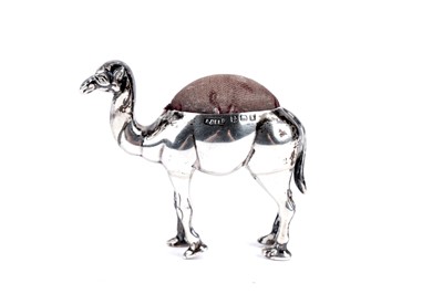 Lot 228 - An Edwardian silver camel pattern pin cushion