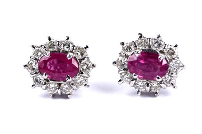 Lot 213 - A pair of ruby and diamond cluster earrings