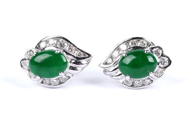 Lot 211 - A pair of jadeite and diamond cluster earrings