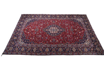 Lot 141 - A hand-knotted Persian Mashad carpet