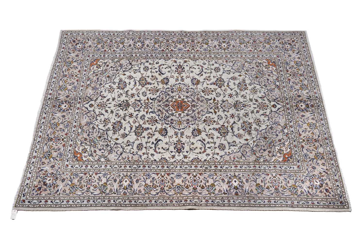 Lot 142 - A hand-knotted Persian Kashan carpet