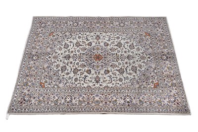 Lot 142 - A hand-knotted Persian Kashan carpet