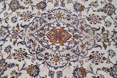 Lot 142 - A hand-knotted Persian Kashan carpet