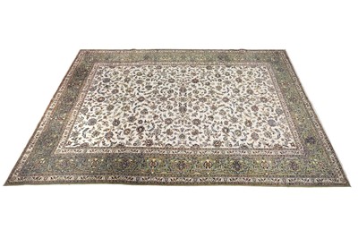 Lot 144 - A hand-knotted Persian Kashan carpet