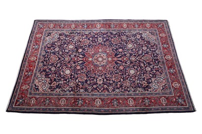 Lot 146 - A hand-knotted Persian Kashan carpet