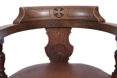 Lot 7 - A pair of early 20th Century ecclesiastical walnut captain's armchairs