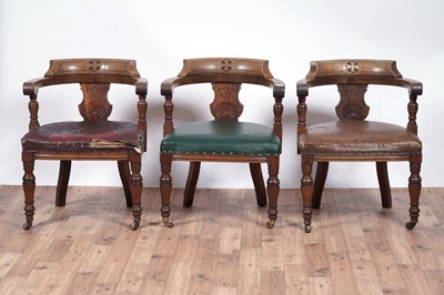 Lot 8 - A trio of early 20th Century ecclesiastical walnut captain's armchairs
