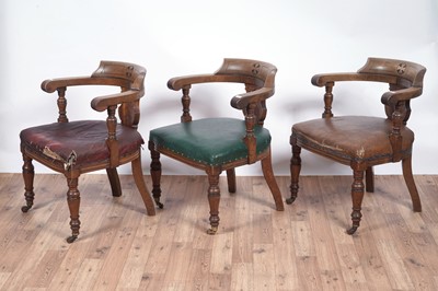 Lot 8 - A trio of early 20th Century ecclesiastical walnut captain's armchairs