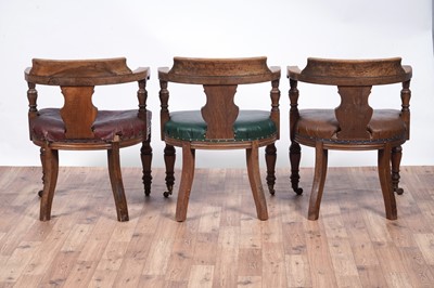 Lot 8 - A trio of early 20th Century ecclesiastical walnut captain's armchairs