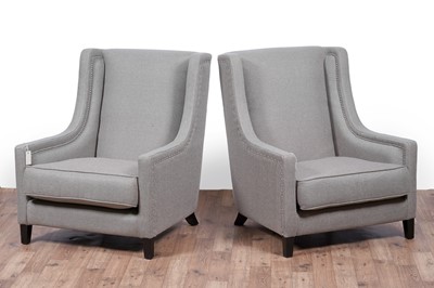 Lot 33 - Kelly Hoppen: a pair of ‘Emma’ wingback armchairs