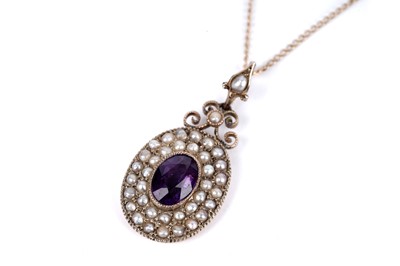 Lot 100A - An early 20th Century rose gold amethyst and seed pearl pendant necklace