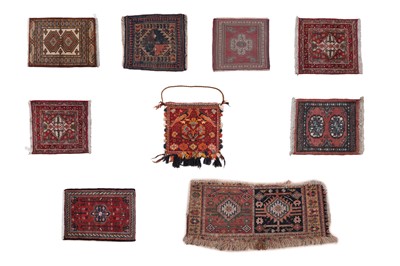 Lot 135 - A collection of rugs of small proportions and saddle bag