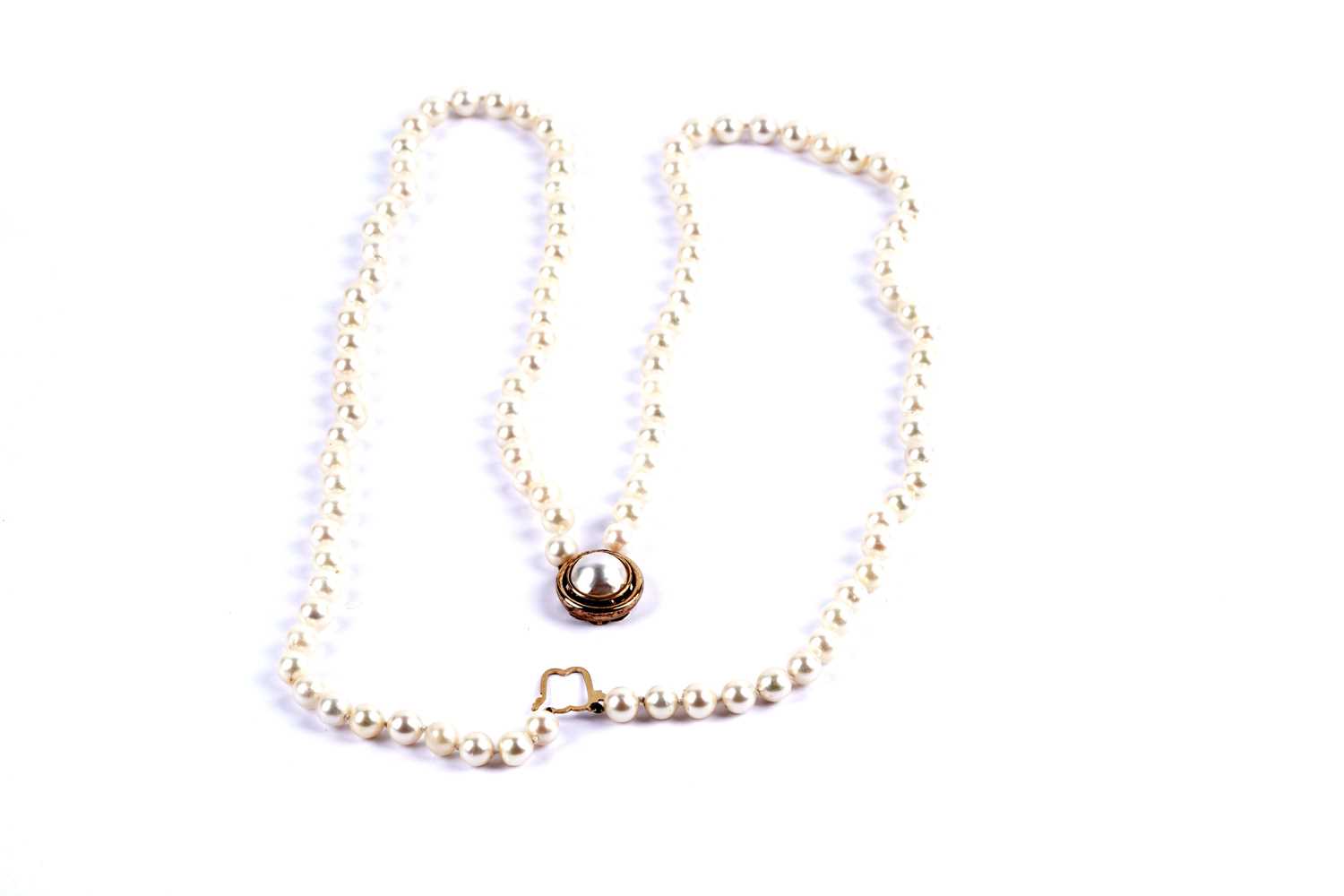 Lot 23 - A double-strand cultured pearl necklace with gold clasp