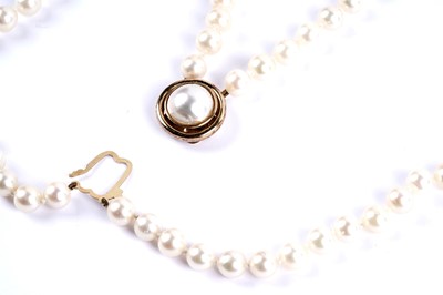 Lot 23 - A double-strand cultured pearl necklace with gold clasp