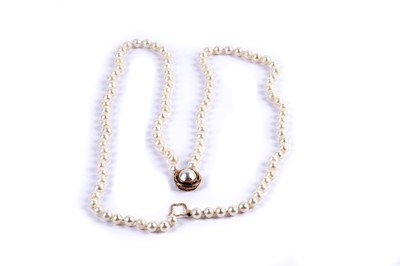 Lot 23 - A double-strand cultured pearl necklace with gold clasp