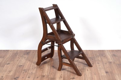Lot 72 - A 20th Century stained hardwood metamorphic library chair