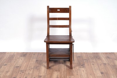 Lot 72 - A 20th Century stained hardwood metamorphic library chair