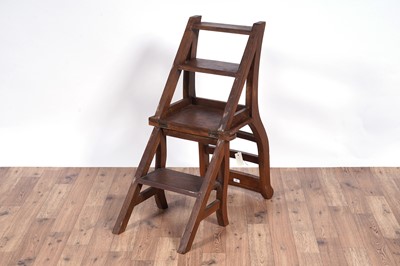 Lot 72 - A 20th Century stained hardwood metamorphic library chair