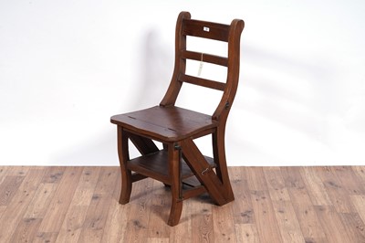 Lot 72 - A 20th Century stained hardwood metamorphic library chair