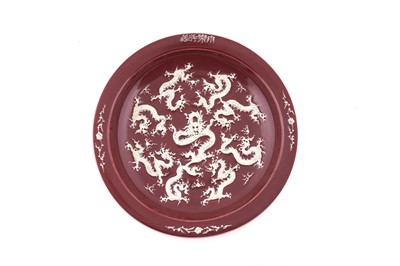 Lot 808 - A Chinese liver-red ground dragon dish