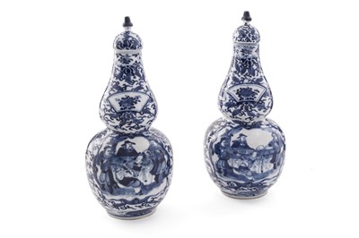 Lot 836 - A pair of Chinese blue and white double gourd vases