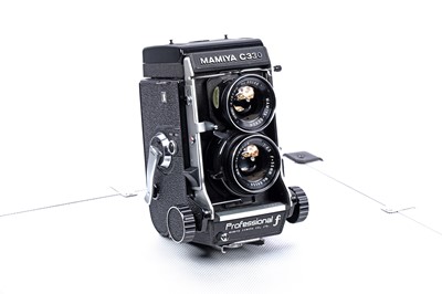 Lot 161 - A Mamiya C330 Professional f, TLR medium-format camera with extra lenses and accessories