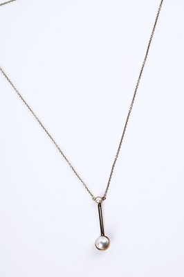 Lot 24 - An Edwardian pearl set gold drop pendant necklace
