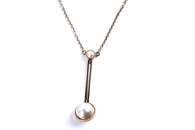 Lot 24 - An Edwardian pearl set gold drop pendant necklace