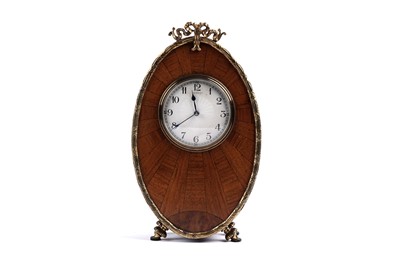 Lot 166 - An early 20th Century walnut mantel clock